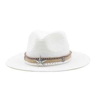 Detail of bohemian white fedora straw hat with turquoise star concho and rustic leather band
