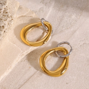 Minimalist 18k gold and silver two-tone irregular hollow dangle earrings on stone