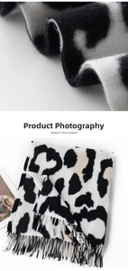 Macro shot of knitted faux cashmere leopard print scarf with soft fringe details