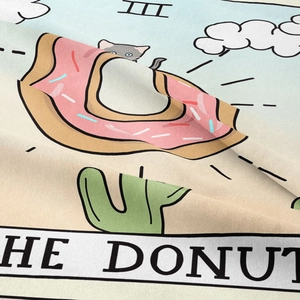 Detail of bohemian tapestry fabric showing The Donut tarot print and twill texture