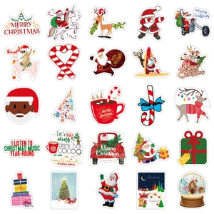 Flat lay of Christmas stickers featuring Santa, gingerbread man and holiday trees