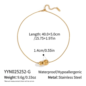 Detail showing 1.4cm golden ball pendant on 40cm stainless steel hypoallergenic chain
