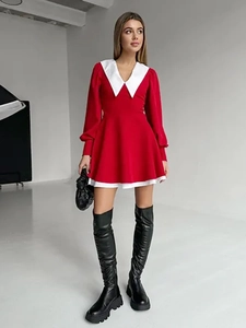 Detail of French style mini dress featuring a sharp white contrast collar and red lantern sleeves
