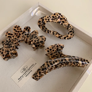 Set of three leopard print acetate hair claws in various shapes for women's hair styling