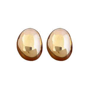 Exaggerated irregular oval gold stud earrings with a high-polished metallic texture