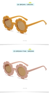 Detail view of sunflower shaped frames in ginger and pale pink with brown lenses
