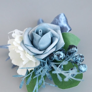Blue and white artificial rose boutonniere with berries and silk ribbon for wedding groom