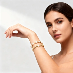 Elegant double-layered baroque pearl and gold beaded bracelet for women on wrist