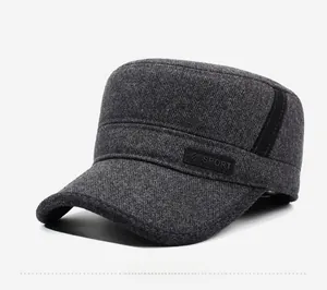 Detailed close-up of dark grey wool winter army cap with sport tag and fabric texture