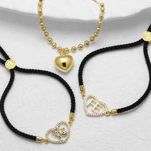 Goldenes Herz-Armband-Set mit Zirkonia und verstellbaren schwarzen Webkordeln