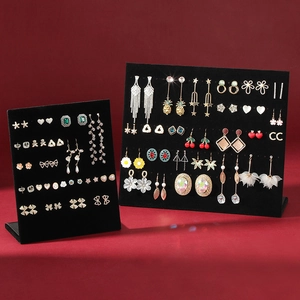 L-shaped black velvet earring display stand with gold and silver jewelry accents