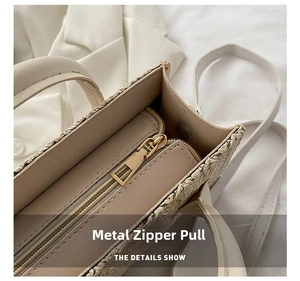 Detail showing high-quality golden metal zipper and internal compartment of woven bag