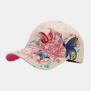 Detailed embroidery of colorful sequins butterflies on a beige cotton baseball cap