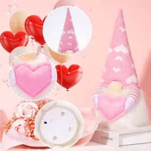 Detail of Valentines gnome showing knit hat texture, plush heart, and battery base