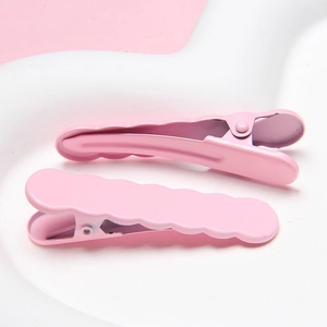 Pink wavy metal hair clips set on heart tray for women stylish hair accessories