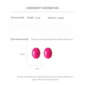 Detail showing dimensions of vintage pink enamel oval earrings in copper, 2.6cm by 2cm size
