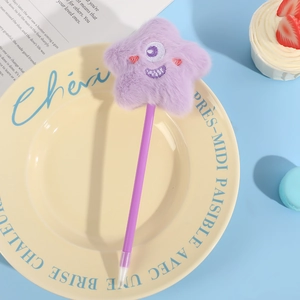Cute purple plush star ballpoint pen with embroidered eye on a decorative blue backdrop