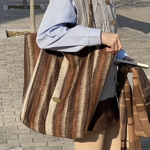 Chic striped wool tote bag with large capacity for women, featuring casual shoulder strap style