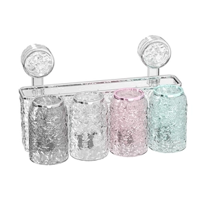 Wall-mounted suction cup toothbrush holder with four colorful hammered texture cups