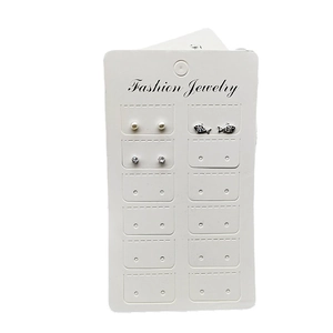 Set of three fashion stud earrings with pearls and rhinestones on a display card