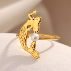 Gold plated mermaid ring with a round white pearl on a minimalist pedestal