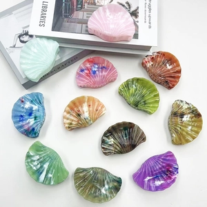 Chic marbled acrylic shell hair clips in various colors arranged on a white background