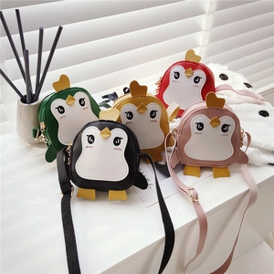 Five colorful cartoon penguin crossbody bags for kids shown with natural shadow lighting