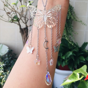 Detail of silver butterfly suncatcher with colorful crystal prisms and hanging chains
