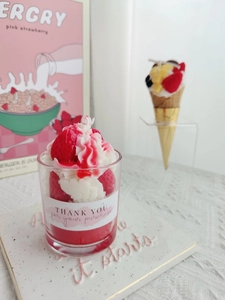 Detail of strawberry cream soy candle in glass cup with Thank You label and wick