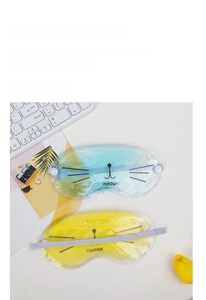Close-up of cat-themed PVC gel eye masks in blue and yellow for hot and cold therapy