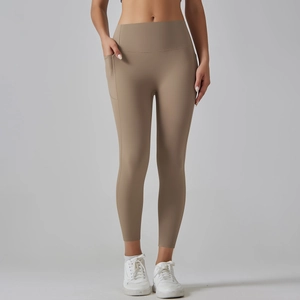 Close-up of high-waisted yoga leggings with side pockets and smooth matte texture