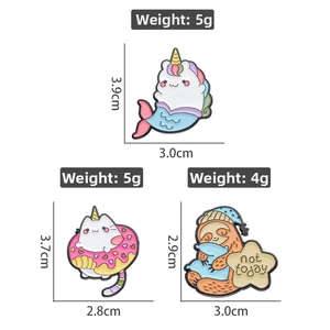 Cartoon animal enamel pins featuring a mermaid unicorn, donut cat, and sloth on white backdrop