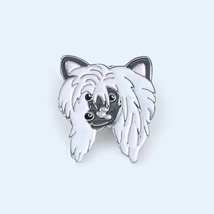 Detailed view of enamel puppy pin featuring a fluffy dog face with silver metal trim