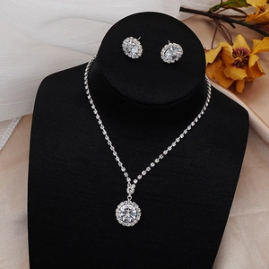 Sparkling zircon rhinestone necklace and earring jewelry set on a black velvet bust