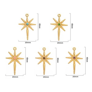 Detail view of 40mm golden star pendants with inlaid multi-colored crystals