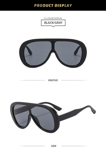 Front and side view of large frame oversized black sunglasses with gray lenses