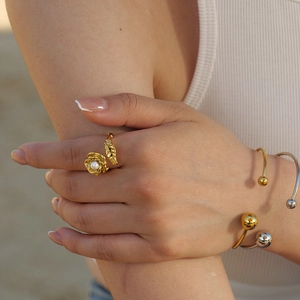 18k gold plated stainless steel pearl flower ring with minimalist bead bangles on a model