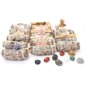 White sage smudge sticks and Palo Santo sticks with raw crystals for meditation yoga