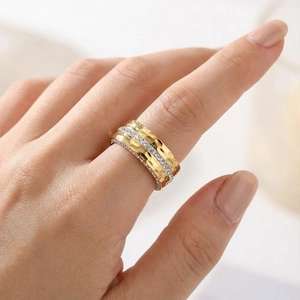 Gold-plated hammered wide band ring for women with pave-set zircon stones on finger