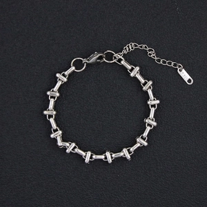 Detail of industrial stainless steel link bracelet with lobster clasp and T15 engraved tag