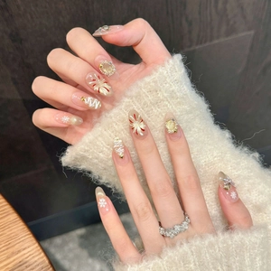 Christmas press-on nails with white snowflakes, pearls and festive tree designs