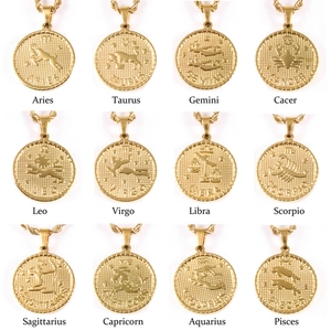 Collection of twelve gold zodiac coin pendants featuring signs like Aries and Leo