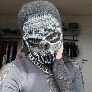Detail of handmade crochet skull balaclava featuring white punk skeleton pattern knit