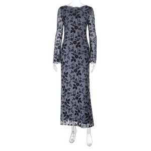 Close-up of the elegant black floral flocking pattern on this long sleeve mesh maxi dress