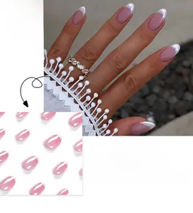 Detailed view of pink gradient French tip almond press-on nails with white edges