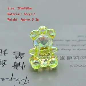 Detail view of 29mm yellow iridescent acrylic bear charm with faceted texture