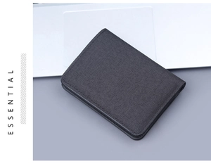 Detailed close-up of dark grey canvas wallet showing high-quality fabric texture and stitching