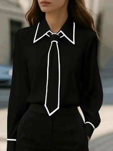 Detail of black long-sleeve shirt featuring minimalist white contrast line accents on collar