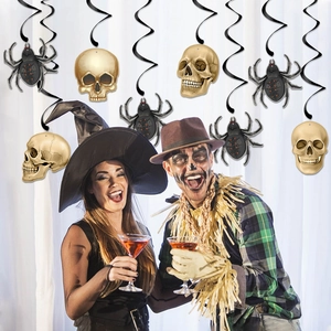 Halloween party decorations featuring black spider and gold skull spiral hanging swirls