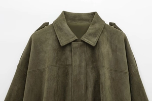 Close-up of dark green suede pilot jacket showing collar and epaulets detail